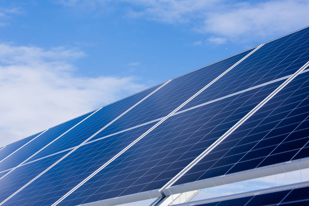 Close-up of a solar array with blue sky in the background