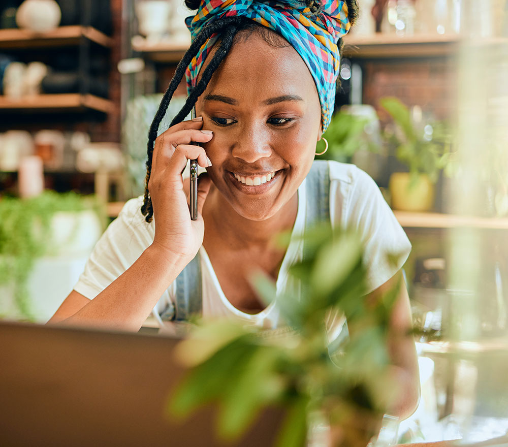 Woman on phone at floral shop