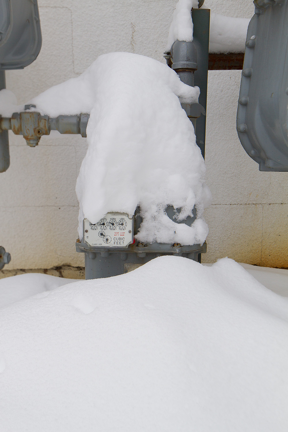 Gas meter covered in snow.