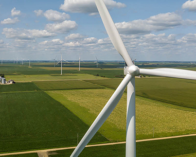 Drone view of a wind turbine in summer.